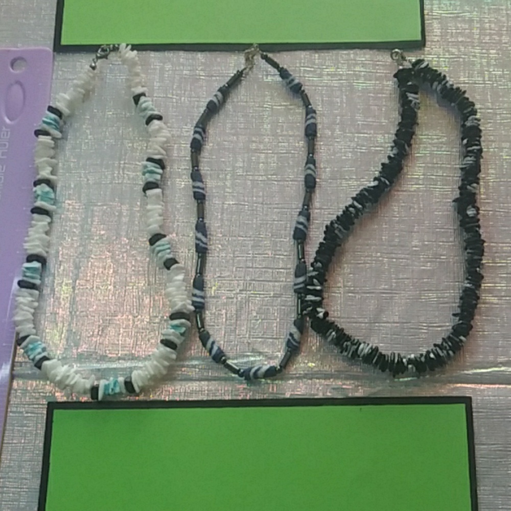 White necklace - 7.8 cm in length.